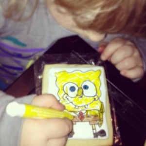 Averie coloring a spongebob cookie I drew up for her