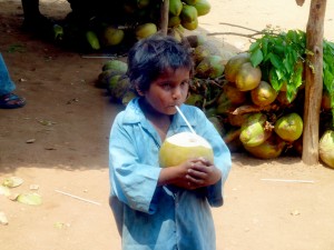 Although we had no extra cash to give him, this little kid was the recipient of my coworkers leftover coconut - and he was SO happy to have it and guzzled it down quickly!